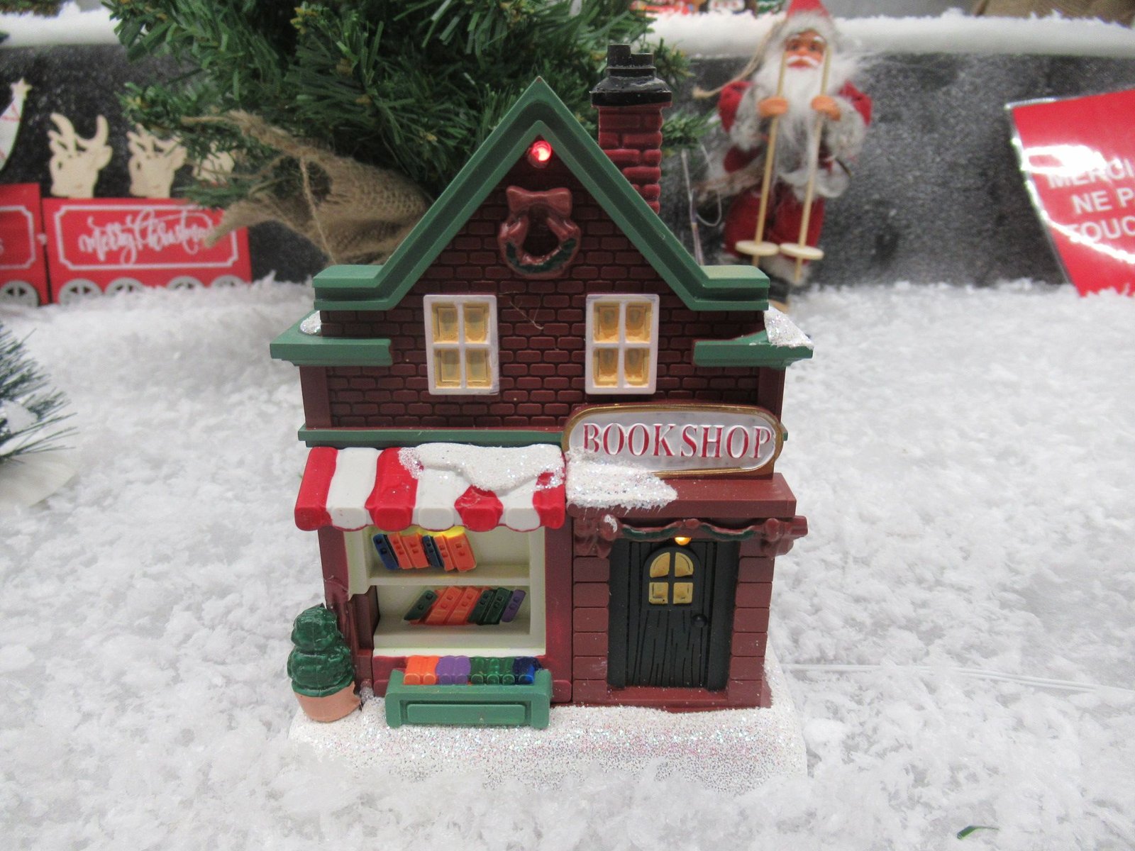Une figurine de village de Noël représentant une librairie, photo gratuite