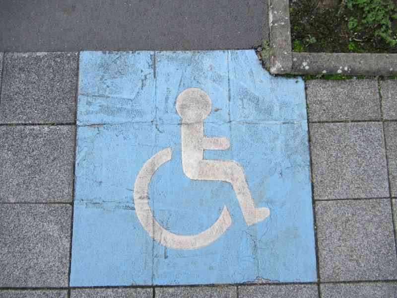 Signe de permis de stationnement pour personnes en fauteuil handicapé